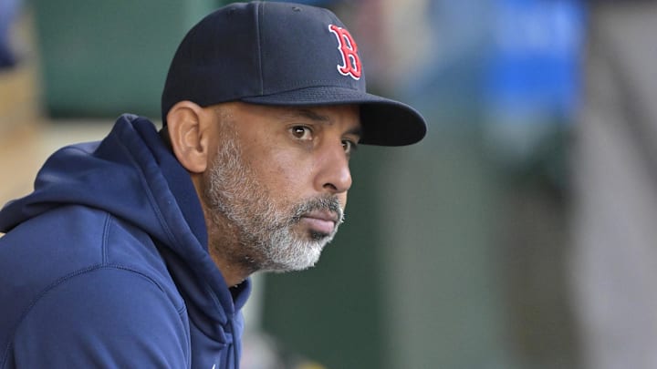 Boston Red Sox manager Alex Cora (13) sits in the dugout before the game against the Los Angeles Angels at Angel Stadium. 