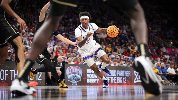 Mar 12, 2025; Kansas City, MO, USA; Kansas Jayhawks guard AJ Storr (2) drives to the basket during the first half against the UCF Knights at T-Mobile Center. Mandatory Credit: William Purnell-Imagn Images