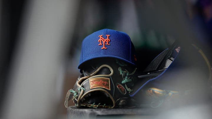 Aug 8, 2024; Denver, Colorado, USA; A New York Mets hat and glove in the dugout in the second inning against the Colorado Rockies at Coors Field. Mandatory Credit: Isaiah J. Downing-Imagn Images Aug 8, 2024; Denver, Colorado, USA; A New York Mets hat and glove in the dugout in the second inning against the Colorado Rockies at Coors Field. Mandatory Credit: Isaiah J. Downing-Imagn Images