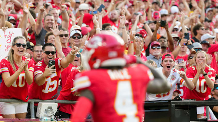 Sep 15, 2024; Kansas City, Missouri, USA; Kansas City Chiefs fans celebrate after a touchdown by Kansas City Chiefs wide receiver Rashee Rice (4) during the first half against the Cincinnati Bengals at GEHA Field at Arrowhead Stadium. Mandatory Credit: Jay Biggerstaff-Imagn Images