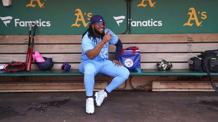 Jun 8, 2024; Oakland, California, USA; Toronto Blue Jays first baseman Vladimir Guerrero Jr. (27) sits in the dugout before the start of the game against the Oakland Athletics at Oakland-Alameda County Coliseum.