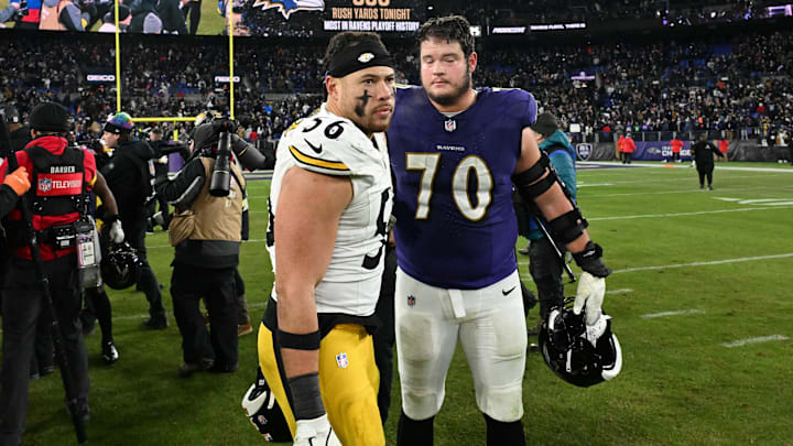 Jan 11, 2025; Baltimore, Maryland, USA; Baltimore Ravens offensive tackle Roger Rosengarten (70) and Pittsburgh Steelers linebacker Alex Highsmith (56) look on after an AFC wild card game at M&T Bank Stadium. Mandatory Credit: Tommy Gilligan-Imagn Images Jan 11, 2025; Baltimore, Maryland, USA; Baltimore Ravens offensive tackle Roger Rosengarten (70) and Pittsburgh Steelers linebacker Alex Highsmith (56) look on after an AFC wild card game at M&T Bank Stadium. Mandatory Credit: Tommy Gilligan-Imagn Images