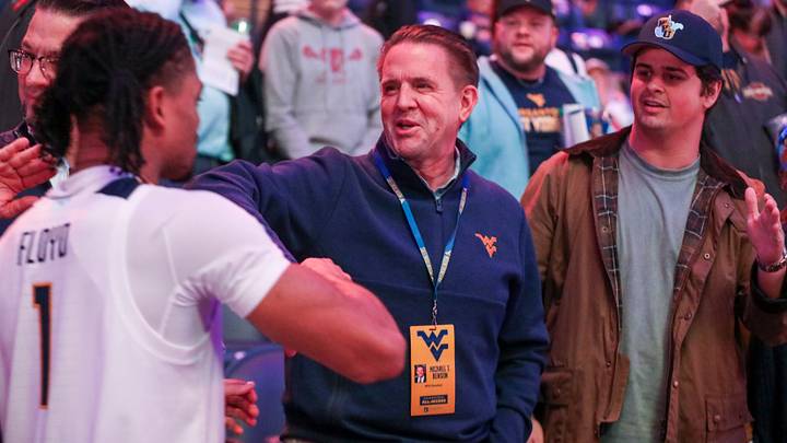 Nov 30, 2025; Morgantown, West Virginia, USA; West Virginia University President Michael Benson celebrates with West Virginia Mountaineers guard Jasper Floyd (1) after defeating the Mercyhurst Lakers at Hope Coliseum. Mandatory Credit: Ben Queen-Imagn Images Nov 30, 2025; Morgantown, West Virginia, USA; West Virginia University President Michael Benson celebrates with West Virginia Mountaineers guard Jasper Floyd (1) after defeating the Mercyhurst Lakers at Hope Coliseum. Mandatory Credit: Ben Queen-Imagn Images