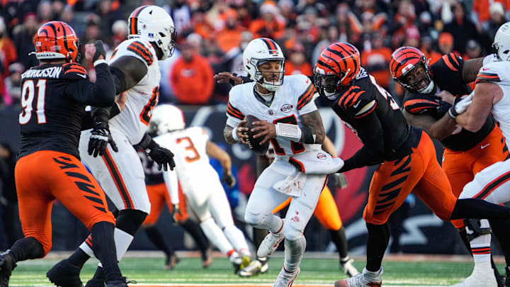 Bengals defense takes down Browns Dorian Thompson-Robinson during their game against the Browns at Paycor Stadium on Sunday December 22, 2024. The Bengals won the game with a final score of 24-6.