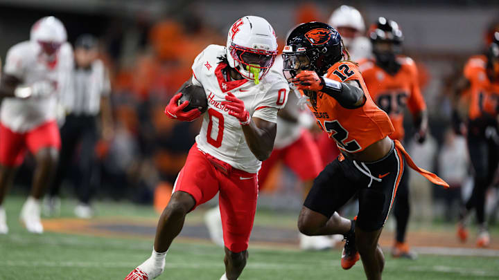 Houston Cougars wide receiver Amare Thomas (0) runs the ball during the fourth quarter against the Oregon State Beavers at Reser Stadium. Houston Cougars wide receiver Amare Thomas (0) runs the ball during the fourth quarter against the Oregon State Beavers at Reser Stadium.