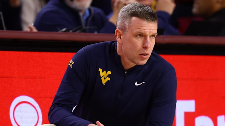 Jan 21, 2026; Tempe, Arizona, USA; West Virginia Mountaineers head coach Ross Hodge against the Arizona State Sun Devils at Desert Financial Arena. Mandatory Credit: Mark J. Rebilas-Imagn Images