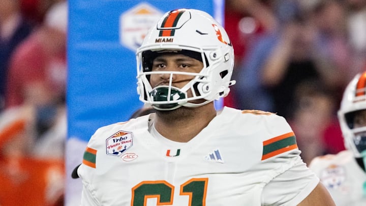 Jan 8, 2026; Glendale, AZ, USA; Miami Hurricanes offensive lineman Francis Mauigoa (61) against the Mississippi Rebels during the 2026 Fiesta Bowl and semifinal game of the College Football Playoff at State Farm Stadium. Mandatory Credit: Mark J. Rebilas-Imagn Images