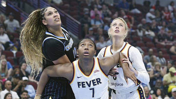 Indiana Fever forward Aliyah Boston (7) and guard Sophie Cunningham (8) defend against Chicago Sky center Kamilla Cardoso (10) Indiana Fever forward Aliyah Boston (7) and guard Sophie Cunningham (8) defend against Chicago Sky center Kamilla Cardoso (10)