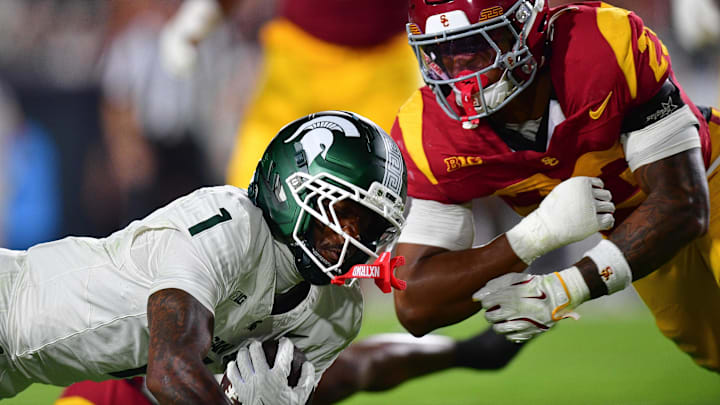 Sep 20, 2025; Los Angeles, California, USA; Southern California Trojans linebacker Desman Stephens II (23) moves in against Michigan State Spartans wide receiver Omari Kelly (1) during the first half at the Los Angeles Memorial Coliseum. Mandatory Credit: Gary A. Vasquez-Imagn Images Sep 20, 2025; Los Angeles, California, USA; Southern California Trojans linebacker Desman Stephens II (23) moves in against Michigan State Spartans wide receiver Omari Kelly (1) during the first half at the Los Angeles Memorial Coliseum. Mandatory Credit: Gary A. Vasquez-Imagn Images