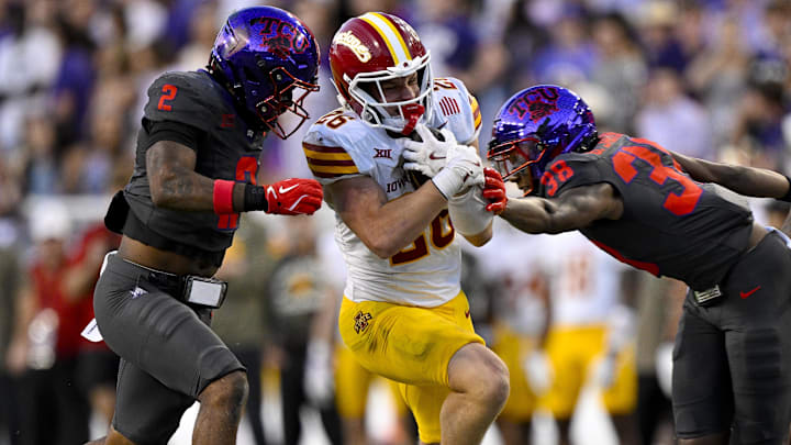 Nov 8, 2025; Fort Worth, Texas, USA; Iowa State Cyclones running back  (26) is tackled by TCU Horned Frogs safety Jamel Johnson (2) and safety  (36) during the second half at Amon G. Carter Stadium. Mandatory Credit: Jerome Miron-Imagn Images