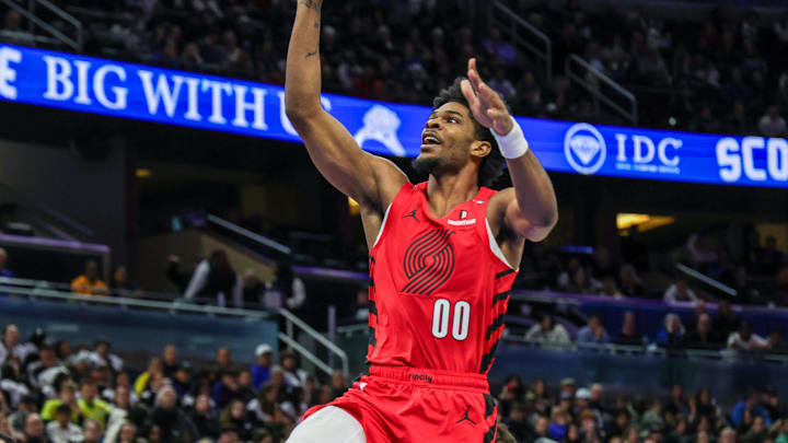 Jan 23, 2025; Orlando, Florida, USA; Portland Trail Blazers guard Scoot Henderson (00) goes to the basket during the second half against the Orlando Magic at Kia Center. Mandatory Credit: Mike Watters-Imagn Images