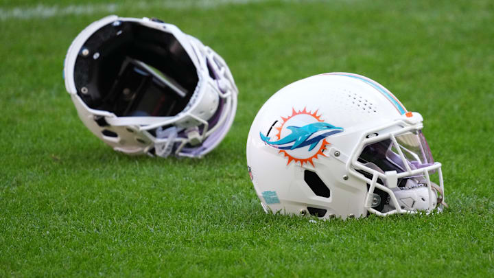 Nov 12, 2025; Madrid, Spain; Miami Dolphins helmets on the field during practice at Estadio Riyadh Air Metropolitano. Mandatory Credit: Kirby Lee-Imagn Images