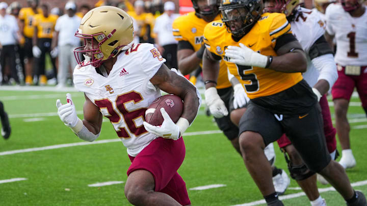 Sep 14, 2024; Columbia, Missouri, USA; Boston College Eagles running back Datrell Jones (26) runs the ball as Missouri Tigers defensive tackle Kristian Williams (5) chases during the first half at Faurot Field at Memorial Stadium. Mandatory Credit: Denny Medley-Imagn Images Sep 14, 2024; Columbia, Missouri, USA; Boston College Eagles running back Datrell Jones (26) runs the ball as Missouri Tigers defensive tackle Kristian Williams (5) chases during the first half at Faurot Field at Memorial Stadium. Mandatory Credit: Denny Medley-Imagn Images
