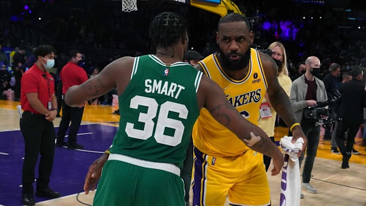 Dec 7, 2021; Los Angeles, California, USA; Boston Celtics guard Marcus Smart (36) and Los Angeles Lakers forward LeBron James (6) embrace after the game at Staples Center.The Lakers defeated the Celtics 117-102.  Mandatory Credit: Kirby Lee-Imagn Images