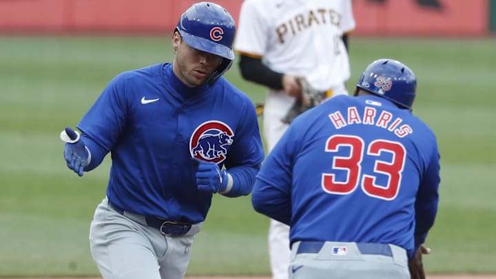 May 11, 2024; Pittsburgh, Pennsylvania, USA; Chicago Cubs third base coach Willie Harris (33) greets shortstop Nico Hoerner (2) circling the bases on a solo home run against the Pittsburgh Pirates during the fourth inning at PNC Park May 11, 2024; Pittsburgh, Pennsylvania, USA; Chicago Cubs third base coach Willie Harris (33) greets shortstop Nico Hoerner (2) circling the bases on a solo home run against the Pittsburgh Pirates during the fourth inning at PNC Park