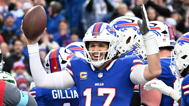 Dec 29, 2024; Orchard Park, New York, USA; Buffalo Bills quarterback Josh Allen (17) celebrates after scoring a rushing touchdown against the New York Jets in the first quarter at Highmark Stadium.