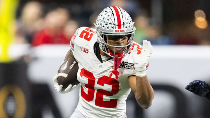 Jan 20, 2025; Atlanta, GA, USA; Ohio State Buckeyes running back TreVeyon Henderson (32) against the Notre Dame Fighting Irish during the CFP National Championship college football game at Mercedes-Benz Stadium. Mandatory Credit: Mark J. Rebilas-Imagn Images