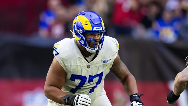 Nov 26, 2023; Glendale, Arizona, USA; Los Angeles Rams offensive tackle Alaric Jackson (77) against the Arizona Cardinals at State Farm Stadium. Mandatory Credit: Mark J. Rebilas-Imagn Images Nov 26, 2023; Glendale, Arizona, USA; Los Angeles Rams offensive tackle Alaric Jackson (77) against the Arizona Cardinals at State Farm Stadium. Mandatory Credit: Mark J. Rebilas-Imagn Images