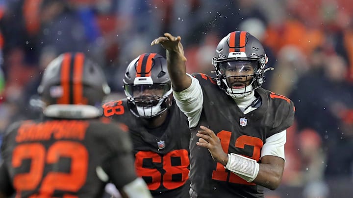 Cleveland Browns quarterback Shedeur Sanders (12) throws a pass to running back Dylan Sampson (22) during the second half of an NFL football game at Huntington Bank Field, Dec. 7, 2025, in Cleveland, Ohio.
