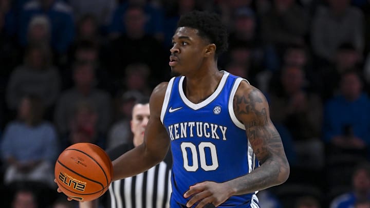Jan 27, 2026; Nashville, Tennessee, USA;  Kentucky Wildcats guard Otega Oweh (00) brings the ball up court against the Vanderbilt Commodores during the first half at Memorial Gymnasium. Mandatory Credit: Steve Roberts-Imagn Images