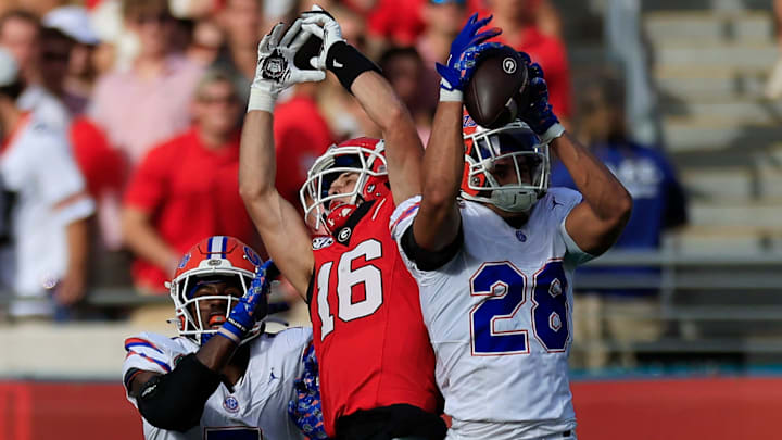 Florida Gators defensive back Devin Moore hauls in an interception on a pass to Georgia Bulldogs receiver London Humphreys