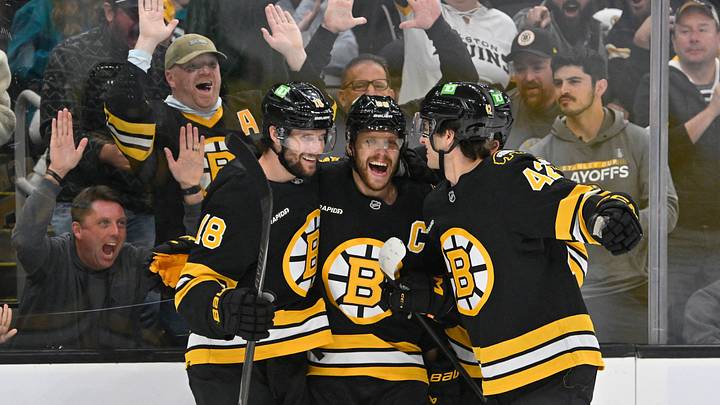 Oct 24, 2026; Boston, Massachusetts, USA; Boston Bruins right wing David Pastrnak (88) celebrates a goal against Alex Nedeljkovic (not pictured) with center Pavel Zacha (18) and defenseman Frederic Brunet (42) during the third period at TD Garden. Mandatory Credit: Eric Canha-Imagn Images