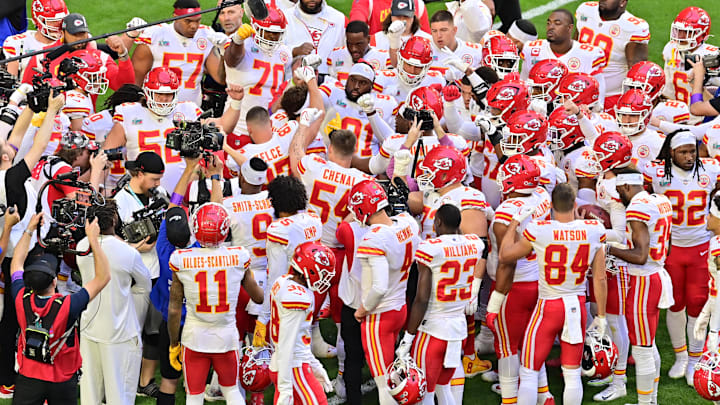 Feb 12, 2023; Glendale, Arizona, US; Members of the Kansas City Chiefs huddle around quarterback Patrick Mahomes (middle) during warm-ups before Super Bowl LVII against the Philadelphia Eagles at State Farm Stadium. Mandatory Credit: Matt Kartozian-Imagn Images