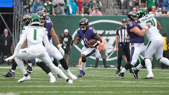 Sep 11, 2022; East Rutherford, New Jersey, USA; Baltimore Ravens quarterback Lamar Jackson (8) carries the ball as New York Jets cornerback Sauce Gardner (1) defends during the first half at MetLife Stadium. Mandatory Credit: Vincent Carchietta-Imagn Images Sep 11, 2022; East Rutherford, New Jersey, USA; Baltimore Ravens quarterback Lamar Jackson (8) carries the ball as New York Jets cornerback Sauce Gardner (1) defends during the first half at MetLife Stadium. Mandatory Credit: Vincent Carchietta-Imagn Images