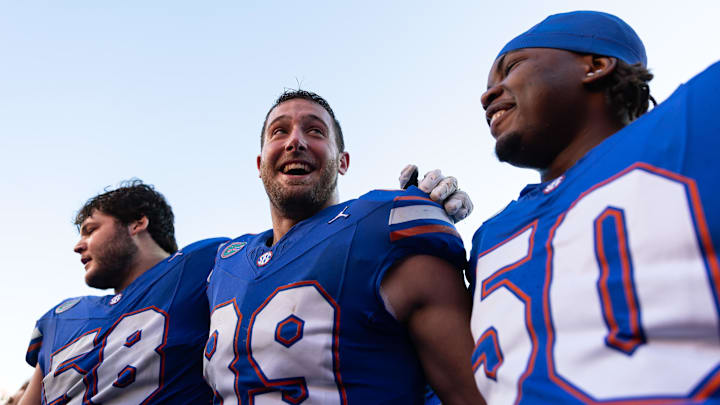 Nov 23, 2024; Gainesville, Florida, USA; Florida Gators tight end Hayden Hansen (89) celebrates with offensive linemen Austin Barber (58) and Jason Zandamela (50) after a game against the Mississippi Rebels at Ben Hill Griffin Stadium. Mandatory Credit: Matt Pendleton-Imagn Images