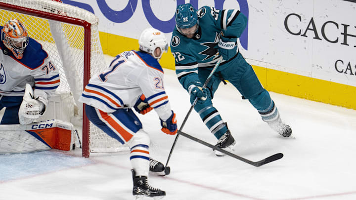 Dec 28, 2023; San Jose, California, USA; San Jose Sharks center Ryan Carpenter (22) attemps to pass
