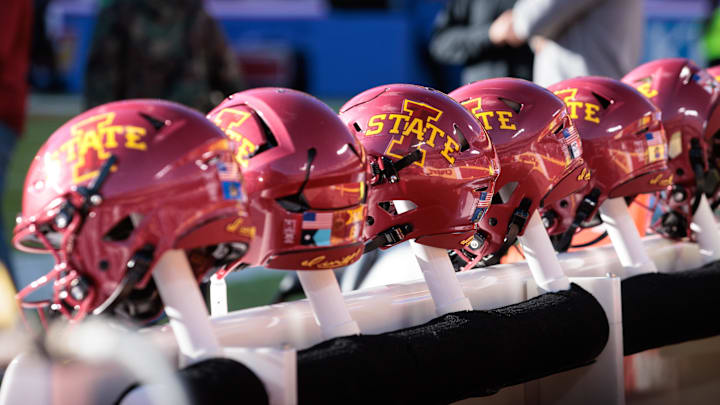 Nov 9, 2024; Kansas City, Missouri, USA; Iowa State Cyclones helmets on the bench during the first quarter against the Kansas Jayhawks at GEHA Field at Arrowhead Stadium. Nov 9, 2024; Kansas City, Missouri, USA; Iowa State Cyclones helmets on the bench during the first quarter against the Kansas Jayhawks at GEHA Field at Arrowhead Stadium.