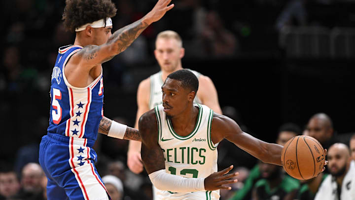Oct 12, 2024; Boston, Massachusetts, USA; Boston Celtics guard Lonnie Walker IV (12) drives to the basket against Philadelphia 76ers guard Lester Quinones (25) during the first half at the TD Garden. Mandatory Credit: Brian Fluharty-Imagn Images Oct 12, 2024; Boston, Massachusetts, USA; Boston Celtics guard Lonnie Walker IV (12) drives to the basket against Philadelphia 76ers guard Lester Quinones (25) during the first half at the TD Garden. Mandatory Credit: Brian Fluharty-Imagn Images