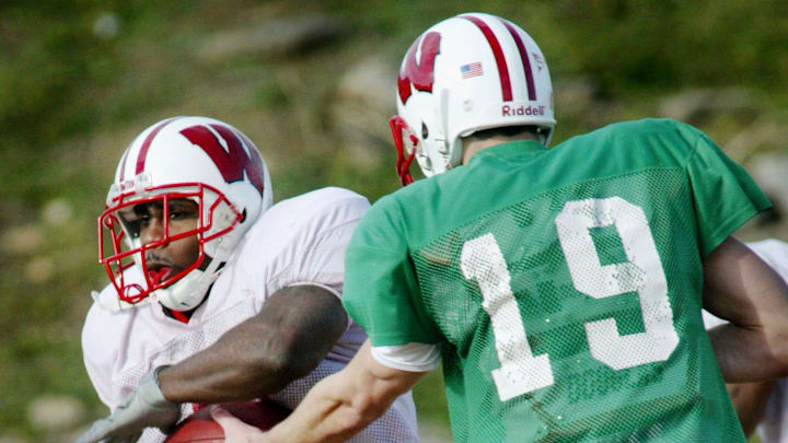 Wisconsin running back Anthony Davis, left, gets the ball from quarterback Jim Sorgi (19) during practice at Goodpasture High School in Madison Dec. 27, 2003.

Music City Bowl