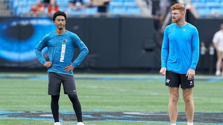 Sep 29, 2024; Charlotte, North Carolina, USA; Carolina Panthers quarterback Bryce Young (9) and quarterback Andy Dalton (14) during pregame warm ups against the Cincinnati Bengals at Bank of America Stadium. 