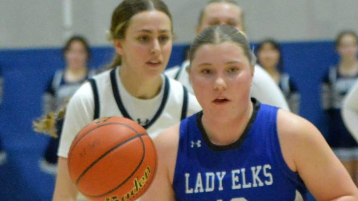 Elkton-Lake Benton's Sydney DeVries heads down the court against Great Plains Lutheran's Kate Holmen during their Region 2A girls basketball game on Feb. 25, 2025.