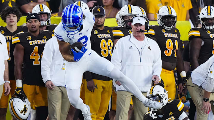 Chase Roberts hauls in a reception as BYU takes down Wyoming in Laramie.