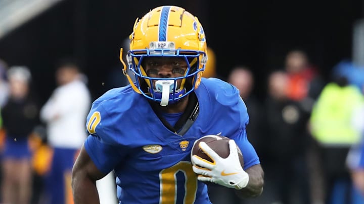 Nov 16, 2024; Pittsburgh, Pennsylvania, USA;  Pittsburgh Panthers running back Desmond Reid (0) runs the ball against the Clemson Tigers during the fourth quarter at Acrisure Stadium.