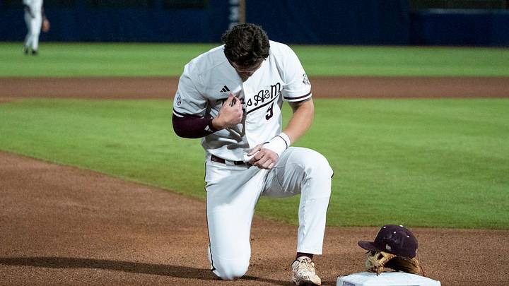 Texas A&M Aggies' Gavin Grahovac (9) prays before Auburn Tigers take on Texas A&M Aggies during the SEC baseball tournament at Hoover Metropolitan Stadium in Hoover, Ala. on Friday, May 22, 2026. Texas A&M Aggies' Gavin Grahovac (9) prays before Auburn Tigers take on Texas A&M Aggies during the SEC baseball tournament at Hoover Metropolitan Stadium in Hoover, Ala. on Friday, May 22, 2026.