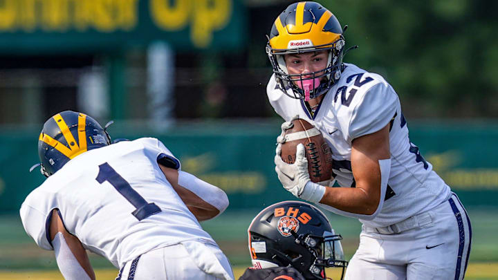 Clarkston's Brady Beck catches the ball against Belleville during the 2024 Xenith Prep Kickoff Classic at Wayne State's Tom Adams Field in Detroit on Friday, Aug. 30, 2024.