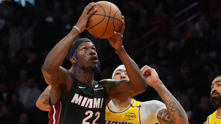 Dec 4, 2024; Miami, Florida, USA;  Miami Heat forward Jimmy Butler (22) goes up for a shot past Los Angeles Lakers forward Anthony Davis (3) in the first half at Kaseya Center. Mandatory Credit: Jim Rassol-Imagn Images