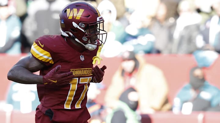 Dec 22, 2024; Landover, Maryland, USA; Washington Commanders wide receiver Terry McLaurin (17) celebrates after catching a touchdown pass against the Philadelphia Eagles during the second quarter at Northwest Stadium. Mandatory Credit: Geoff Burke-Imagn Images