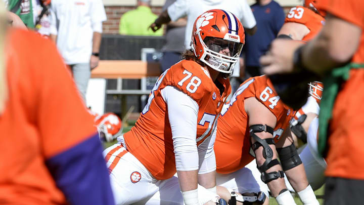 Oct 19, 2024; Clemson, South Carolina, USA; Clemson Tigers offensive lineman Blake Miller (78) stretches during warm ups prior to the game against the Virginia Cavaliers at Memorial Stadium. Mandatory Credit: Alexander Hicks-Imagn Images