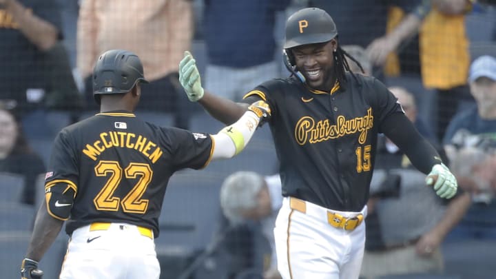 Sep 9, 2024; Pittsburgh, Pennsylvania, USA;  Pittsburgh Pirates center fielder Oneil Cruz (15) celebrates his solo home run with designated hitter Andrew McCutchen (22) against the Miami Marlins during the first inning at PNC Park. Mandatory Credit: Charles LeClaire-Imagn Images