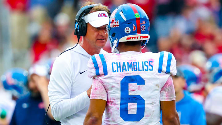 Oct 25, 2025; Norman, Oklahoma, USA;  Ole Miss Rebels head coach Lane Kiffin speaks with Ole Miss Rebels quarterback Trinidad Chambliss (6) during the second half at Gaylord Family-Oklahoma Memorial Stadium. Mandatory Credit: Kevin Jairaj-Imagn Images