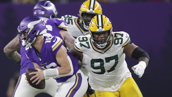 Dec 31, 2023; Minneapolis, Minnesota, USA; Green Bay Packers defensive tackle Kenny Clark (97) pressures Minnesota Vikings quarterback Jaren Hall (16) during their game at U.S. Bank Stadium. Mandatory Credit: Dan Powers-Imagn Images