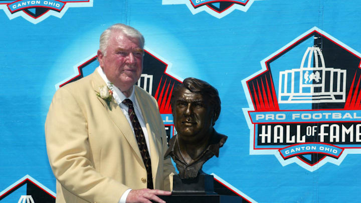 Aug 5, 2006; Canton, OH, USA; Former Oakland Raiders head coach John Madden with his bust during his enshrinement to the Pro Football Hall of Fame at Fawcett Stadium. Mandatory Credit: Matthew Emmons-Imagn Images © copyright Matthew Emmons
