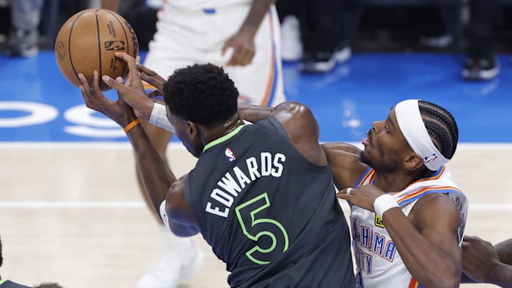 May 20, 2025; Oklahoma City, Oklahoma, USA; Minnesota Timberwolves guard Anthony Edwards (5) and Oklahoma City Thunder guard Shai Gilgeous-Alexander (2) fight for a rebound in the first quarter during game one of the western conference finals for the 2025 NBA Playoffs at Paycom Center. Mandatory Credit: Alonzo Adams-Imagn Images May 20, 2025; Oklahoma City, Oklahoma, USA; Minnesota Timberwolves guard Anthony Edwards (5) and Oklahoma City Thunder guard Shai Gilgeous-Alexander (2) fight for a rebound in the first quarter during game one of the western conference finals for the 2025 NBA Playoffs at Paycom Center. Mandatory Credit: Alonzo Adams-Imagn Images