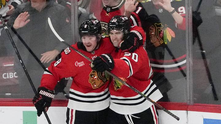 Apr 15, 2026; Chicago, Illinois, USA; Chicago Blackhawks center Ryan Greene (20) celebrates his goal against the San Jose Sharks with center Ryan Donato (8) during the third period at United Center. Mandatory Credit: David Banks-Imagn Images