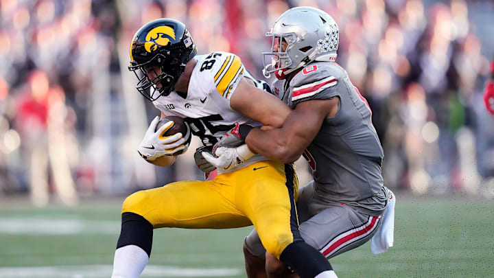 Oct 5, 2024; Columbus, OH, USA; Ohio State Buckeyes linebacker Cody Simon (0) tackles Iowa Hawkeyes tight end Luke Lachey (85) after a catch in the third quarter during the NCAA football game at Ohio Stadium.