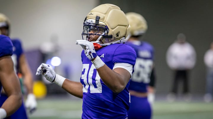 Ansu Sanoe carries a 6-foot-2, 241-pound running-back frame. 